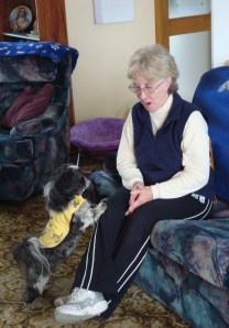 Tyra alerts Caroline to the timer on the kitchen oven