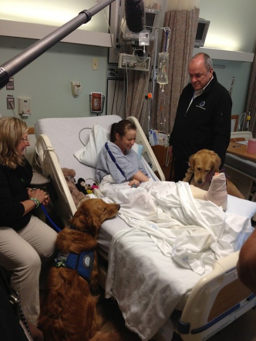 Luther and Ruthie visit with a survivor before surgery for a leg injury (courtesy Lutheran Church Charities)