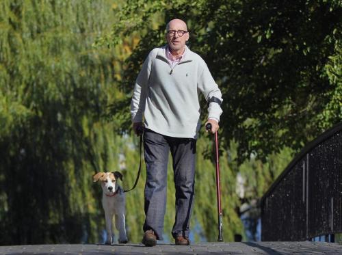 Jeff Schwartz and Mandy on an outing. After his devastating accident, Schwartz rescued a dog and his own way of living. (Photo credit: Wendy Maeda/Globe Staff)
